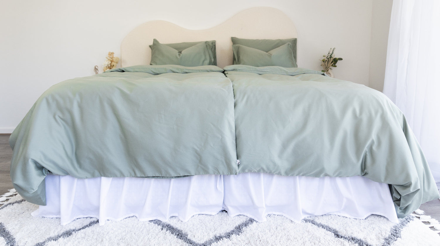 bed styled with eucalyptus green sheet and quilt cover set with 2 single doonas