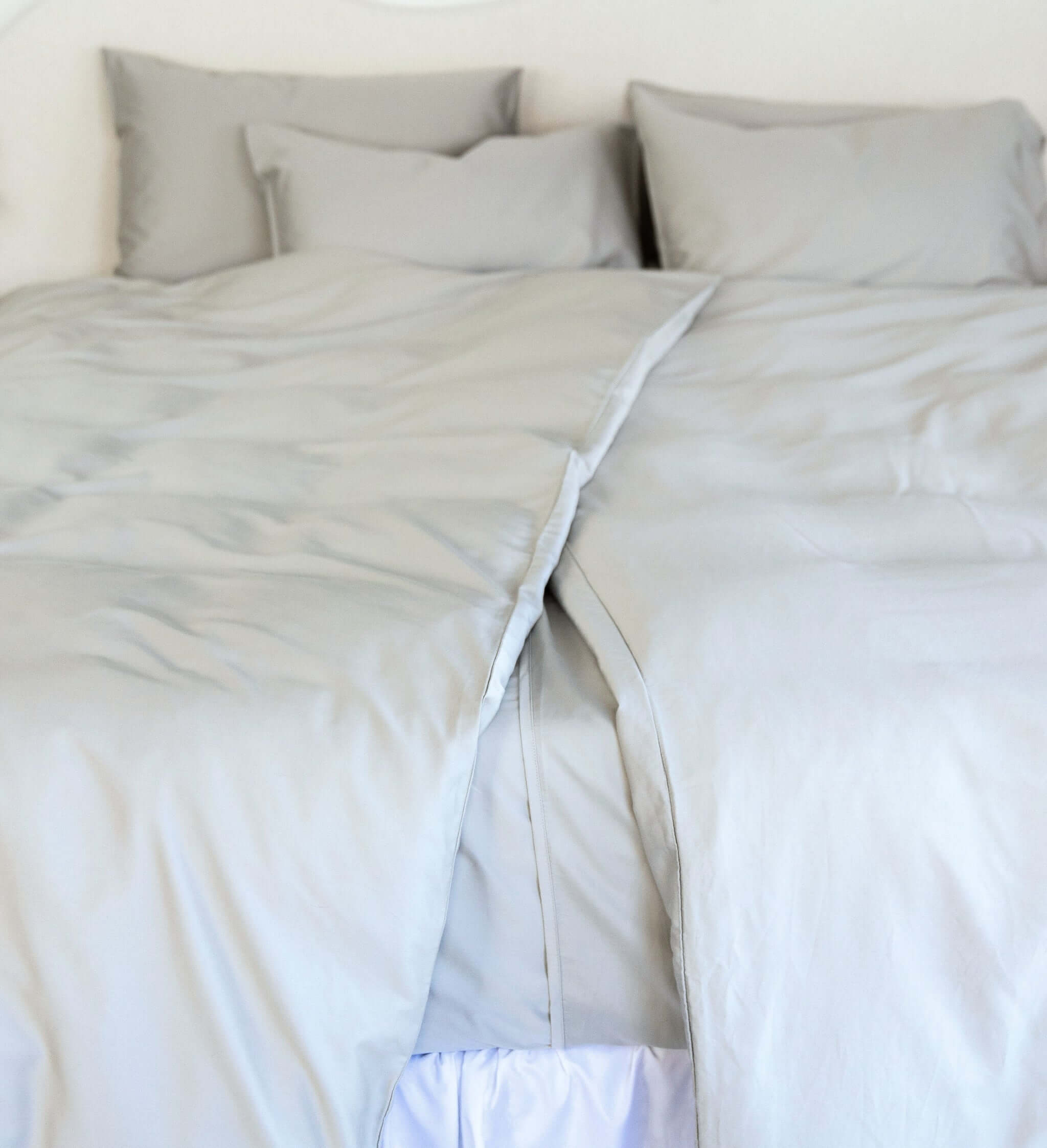 close up of twin single bamboo cotton Quilt cover set in grey sage styled on bed