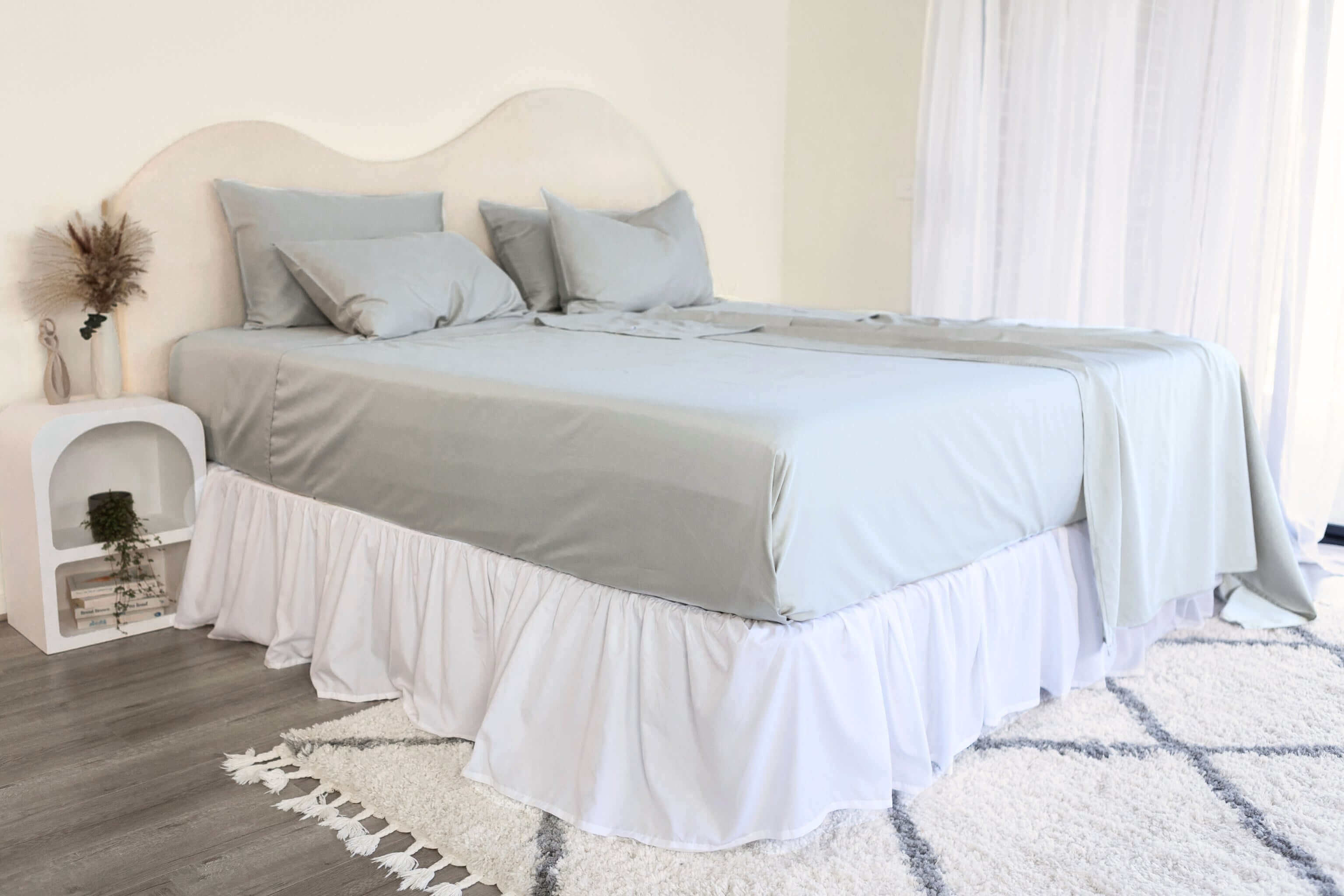 King/Queen bamboo cotton sheet set in grey sage styled on bed