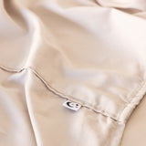 Close up of King/Queen bamboo cotton sheet hemming in beige