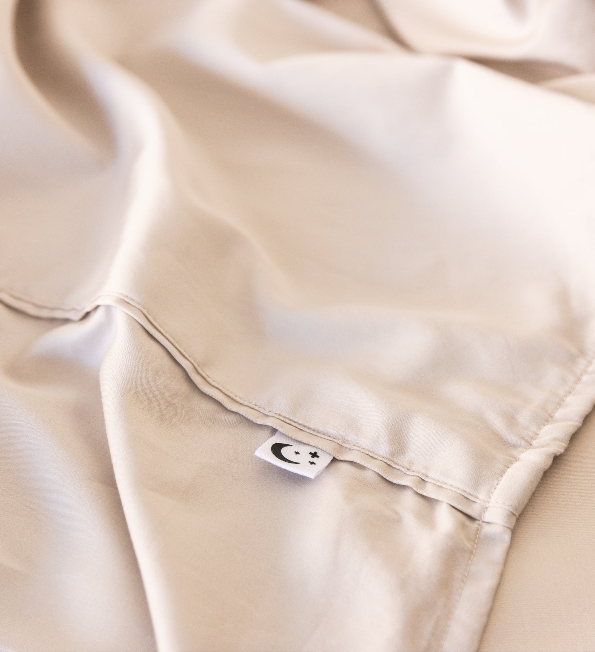 Close up of King/Queen bamboo cotton sheet hemming in beige
