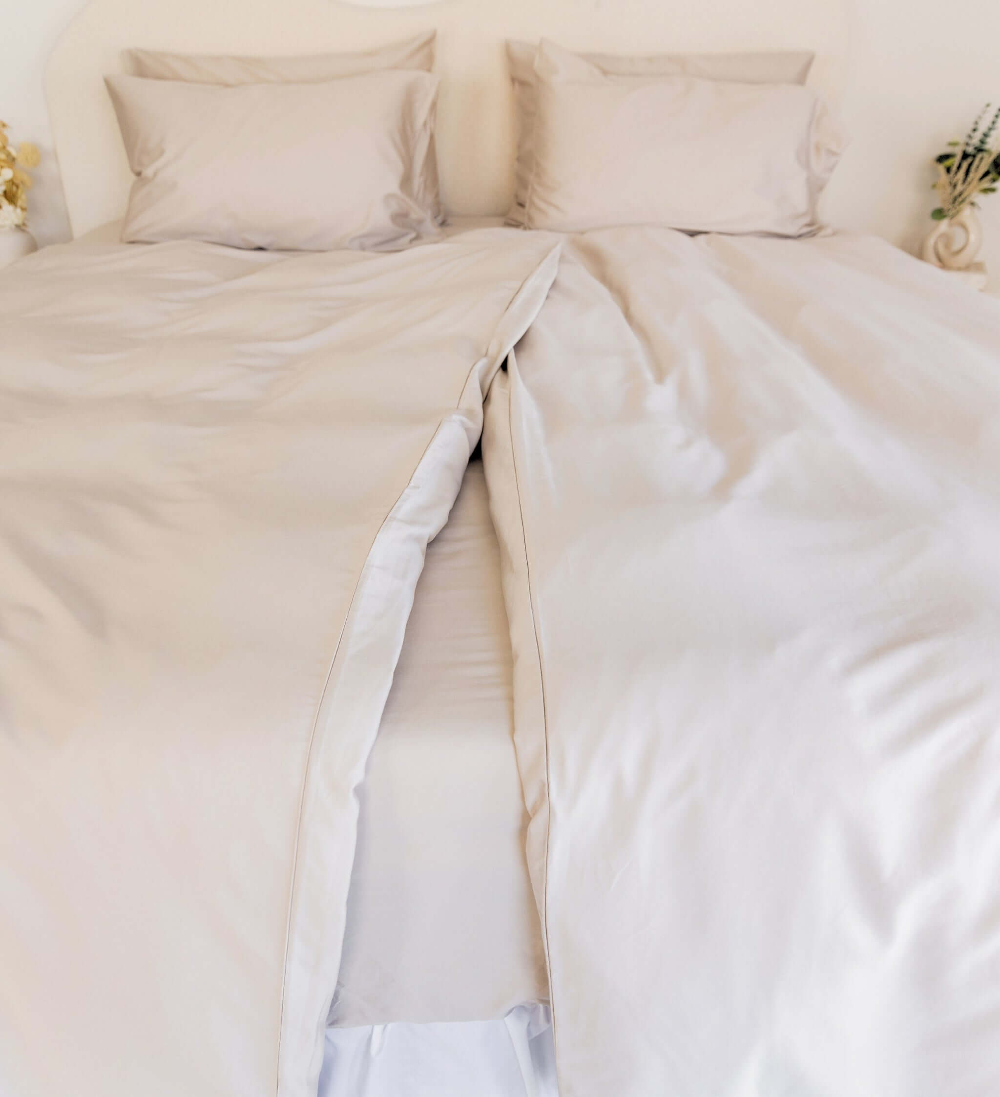 Close up of twin single bamboo cotton quilt cover set in beige styled on bed