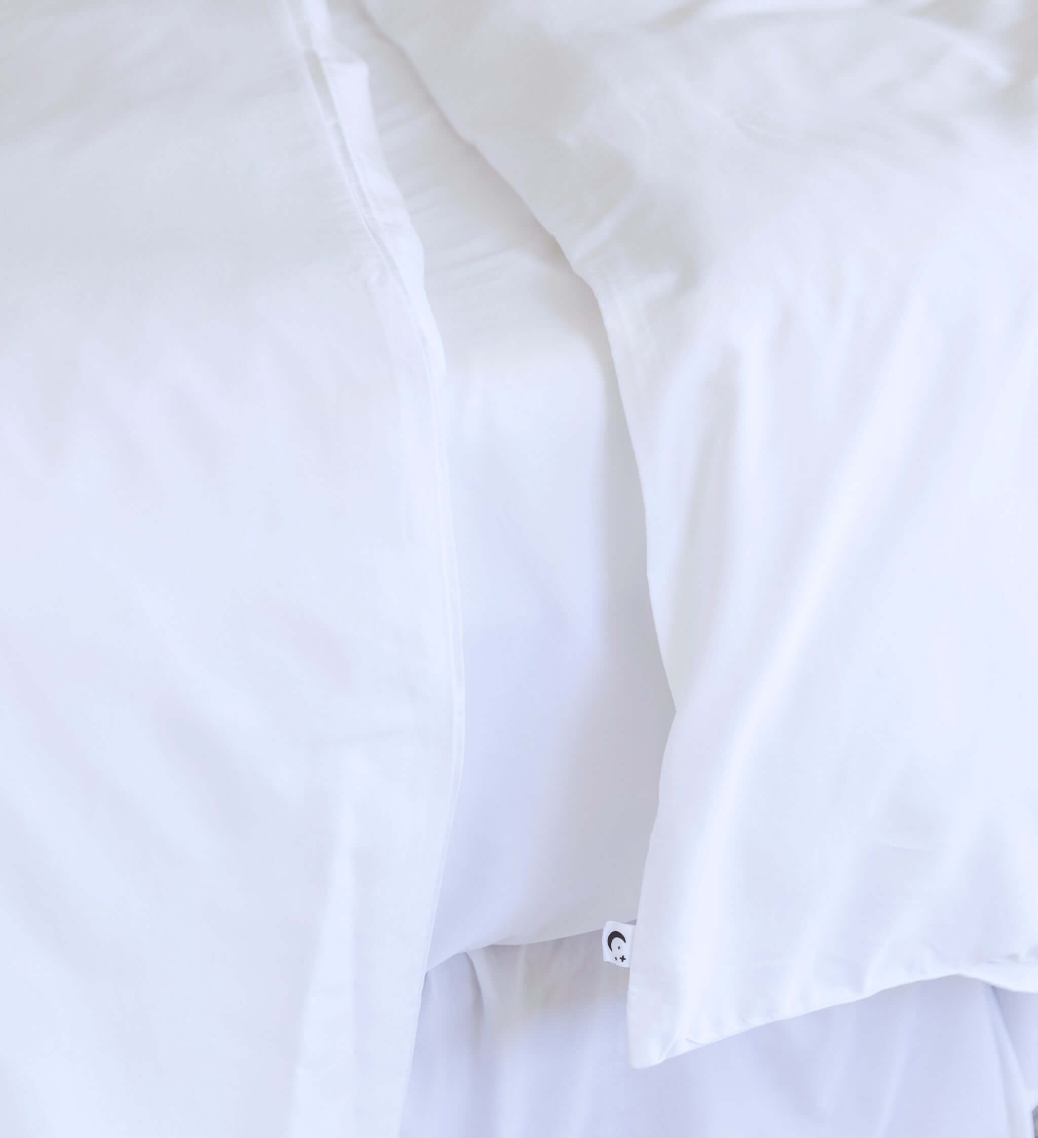 close up of twin single bamboo cotton Quilt cover set in white styled on bed