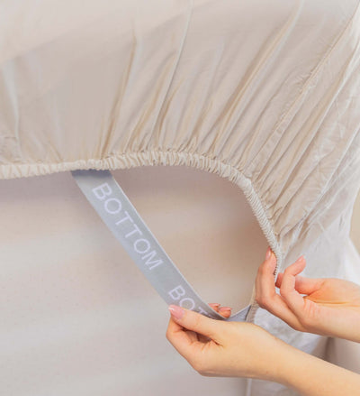 bamboo cotton beige fitted sheet corner support strap labelled with bottom