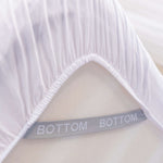 white fitted sheet corner support strap labelled with bottom