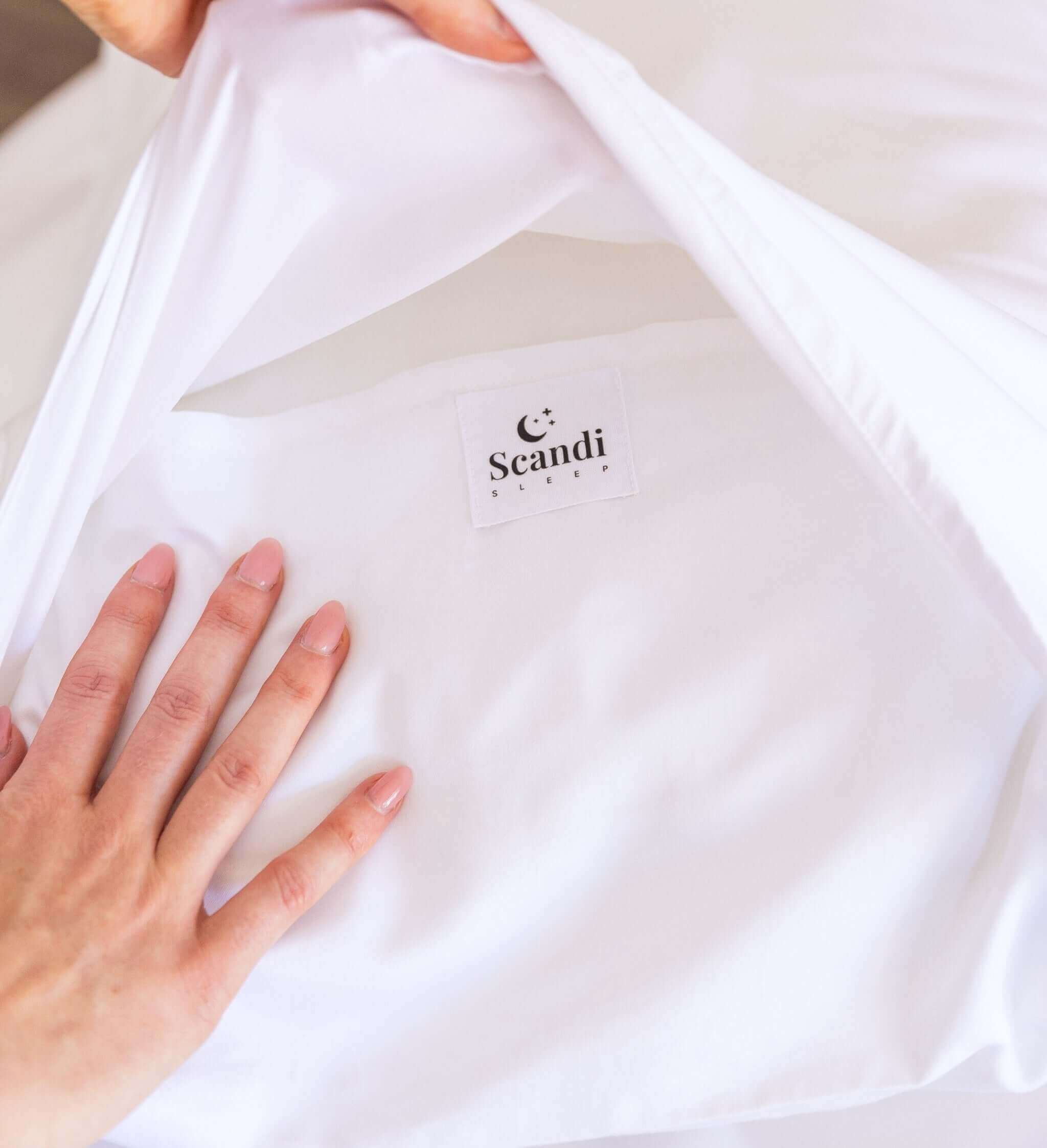 close up of white bamboo cotton pillow cover with deep fold