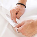 close up of snap button closure on white quilt cover