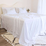 King/Queen bamboo cotton sheet set in white styled on bed