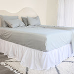 King/Queen bamboo cotton sheet set in grey sage styled on bed
