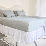 King/Queen bamboo cotton sheet set in grey sage styled on bed