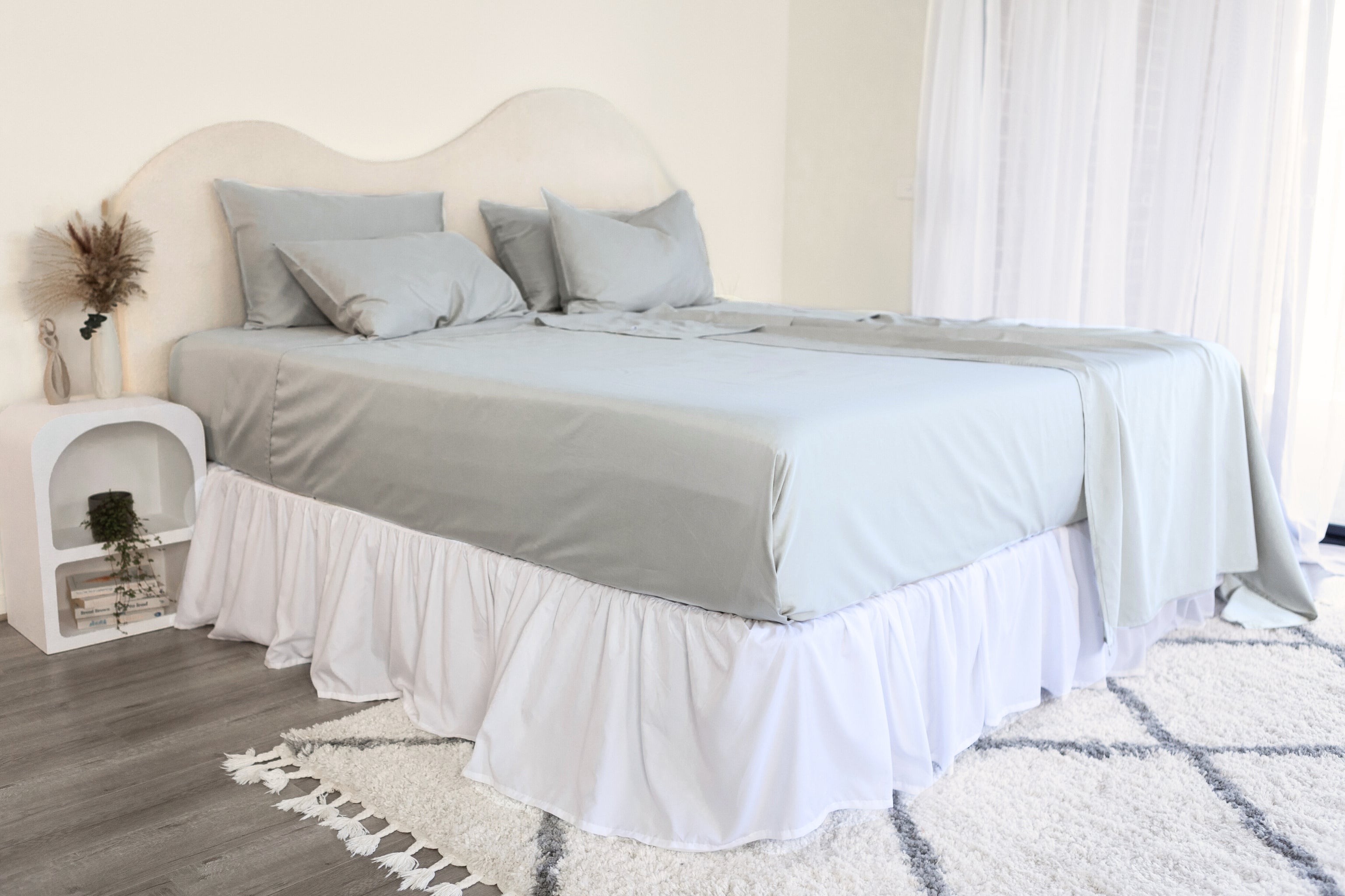 King/Queen bamboo cotton sheet set in grey sage styled on bed