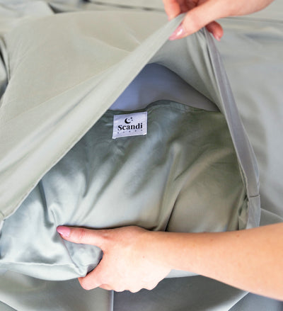 close up of eucalyptus green bamboo cotton deep fold pillow closure