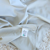 Close-up of bamboo cotton sateen weave in grey sage