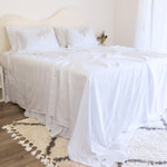 King/Queen bamboo cotton sheet set in white styled on bed