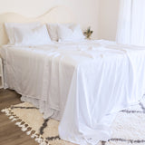 King/Queen bamboo cotton sheet set in white styled on bed